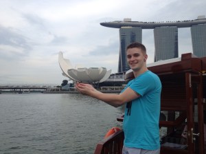 "Hold the flower, hold the flower!" the river tour guide shouted eagerly. I'm still not sure what the building is, but the towering Marina Bay Sands is visible behind me.