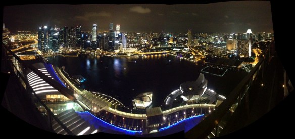 Panoramic view from the 57th level of Marina Bay Sands at night.