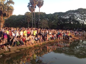 The throng of tourists crowding around the pool in anticipation.