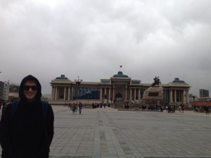 In Sukhbaatar Square, with the Mongolian Parliament House in the background.