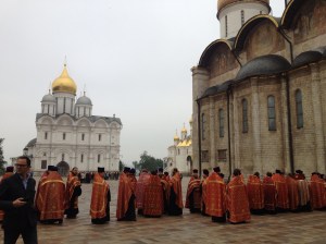 The crowd of priests who were standing around in the grounds of the Kremlin.