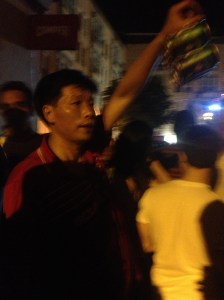One of the numerous Asian people who were running around Chueca with their bags of beer cans.