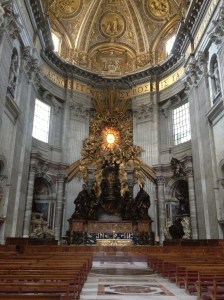 The main alter in the church, featuring the Apse Cathedra (the chair of St Peter) and the Apse Gloria (the stained glass window). 