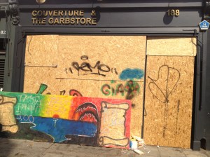 The barricades over some of the shops in the area.