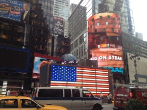 Bright lights and traffic in the concrete jungle. 